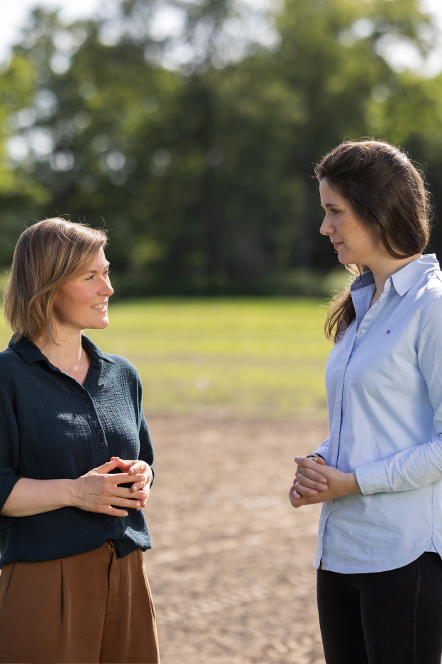 Handshake in front of grain field